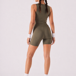 A woman wearing womens-khaki-high-waist-biker-shorts back view showing the butt lifting fit and wide waistband