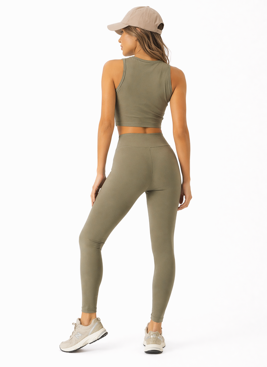A woman wearing womens-khaki-high-waist-leggings back view showing the butt lifting shape and full length fit