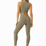 A woman wearing womens-khaki-high-waist-leggings back view showing the butt lifting shape and full length fit