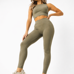 A woman in womens-khaki-high-waist-leggings in an active lunge pose showing full range of movement and flexibility