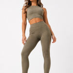 Full length view of a woman wearing a Women's Khaki Racer Neck Crop Top with matching leggings