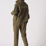 Rear view of a khaki sweatshirt showing the funnel neck and relaxed fit
