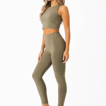 A woman wearing womens-khaki-high-waist-tummy-control-leggings side view showing the shaping fit and deep waistband