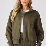 Front view of a khaki sweatshirt for women with a structured funnel neck