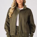 Front view of a khaki sweatshirt for women with a structured funnel neck