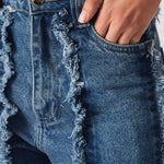 Front pose of Womens Mid Blue Wash jeans with frayed seams