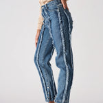 Side profile of Womens Mid Blue Wash frayed seam jeans