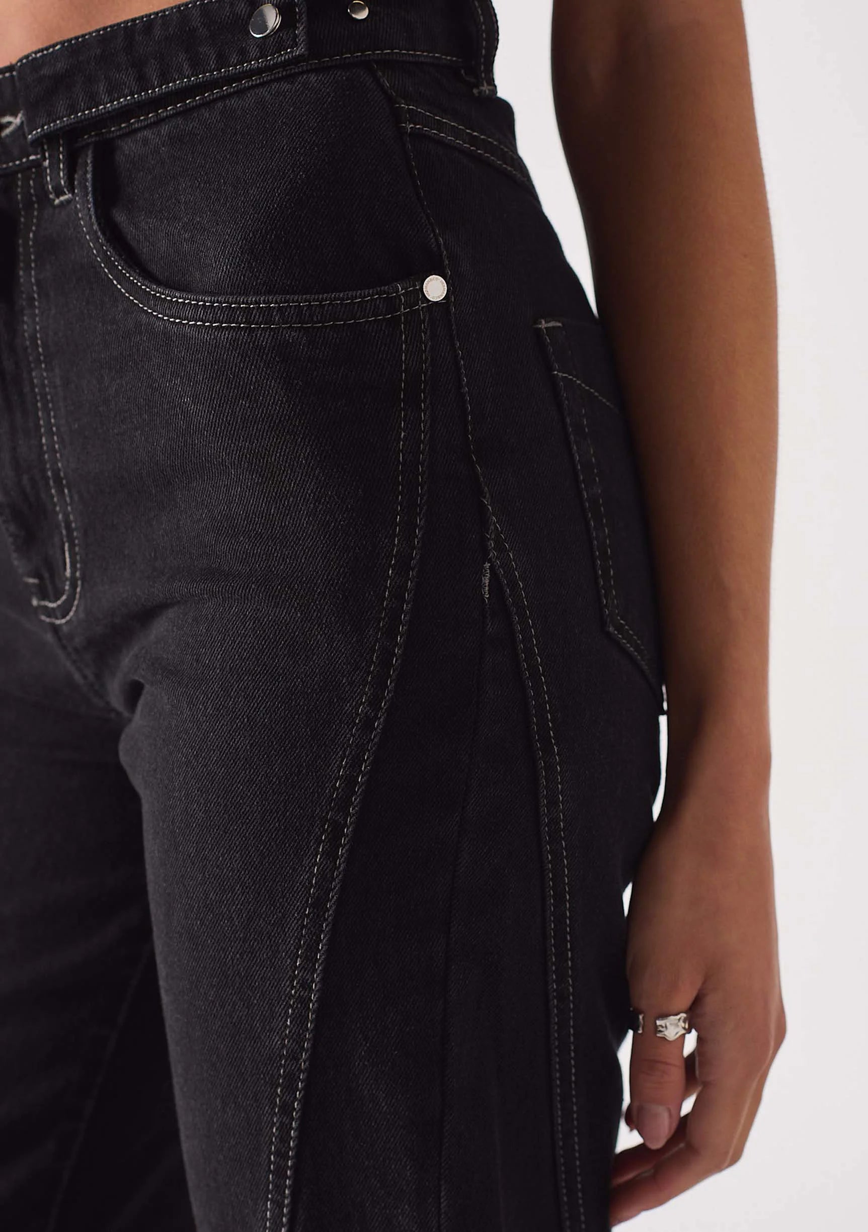 Close-up of the contrast side seam on Women's Popper Detail Black Jeans