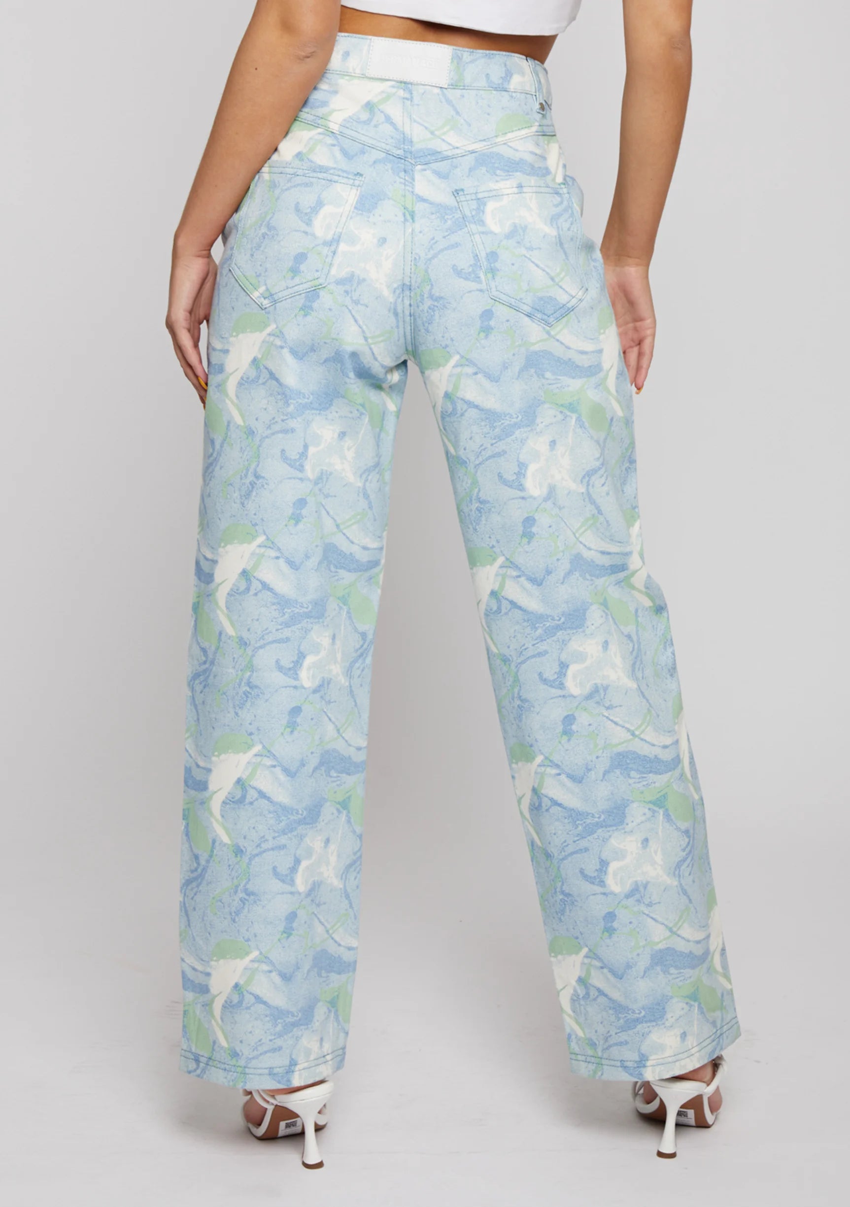 Back view of Womens Psychedelic Marble jeans with patch pockets