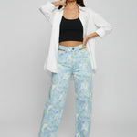 Full body stance of Womens Psychedelic Marble jeans with white top