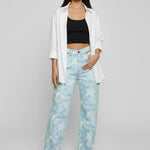 Standing pose wearing Womens Psychedelic Marble jeans with white shirt