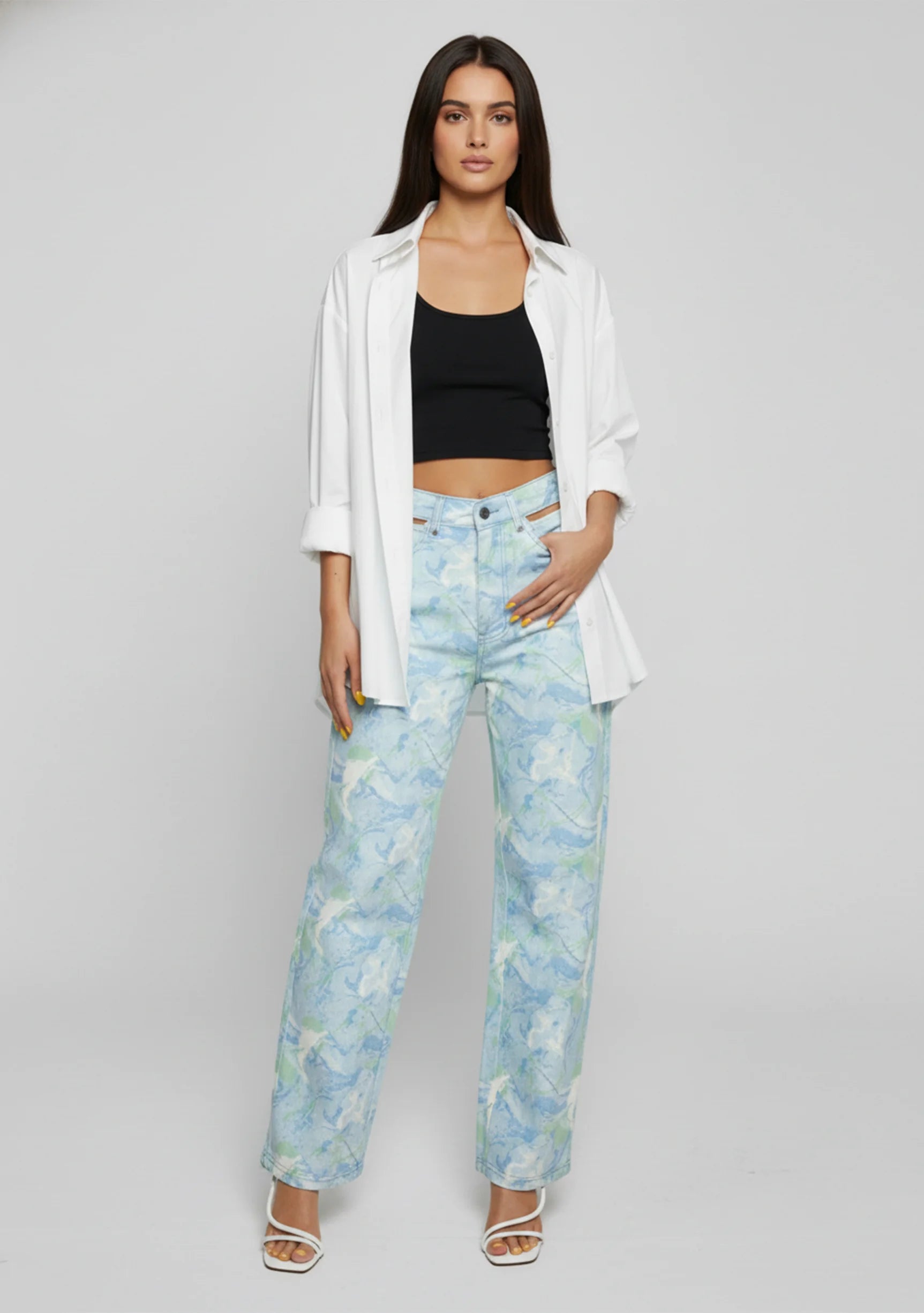 Standing pose wearing Womens Psychedelic Marble jeans with white shirt