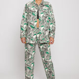 A model styled in the women's psychedelic print jeans with a matching jacket.