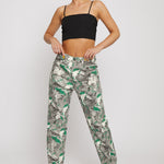 Front view of a model wearing the women's psychedelic print straight-leg jeans.