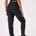 Back view of womens relaxed interlock pintuck jogger in black