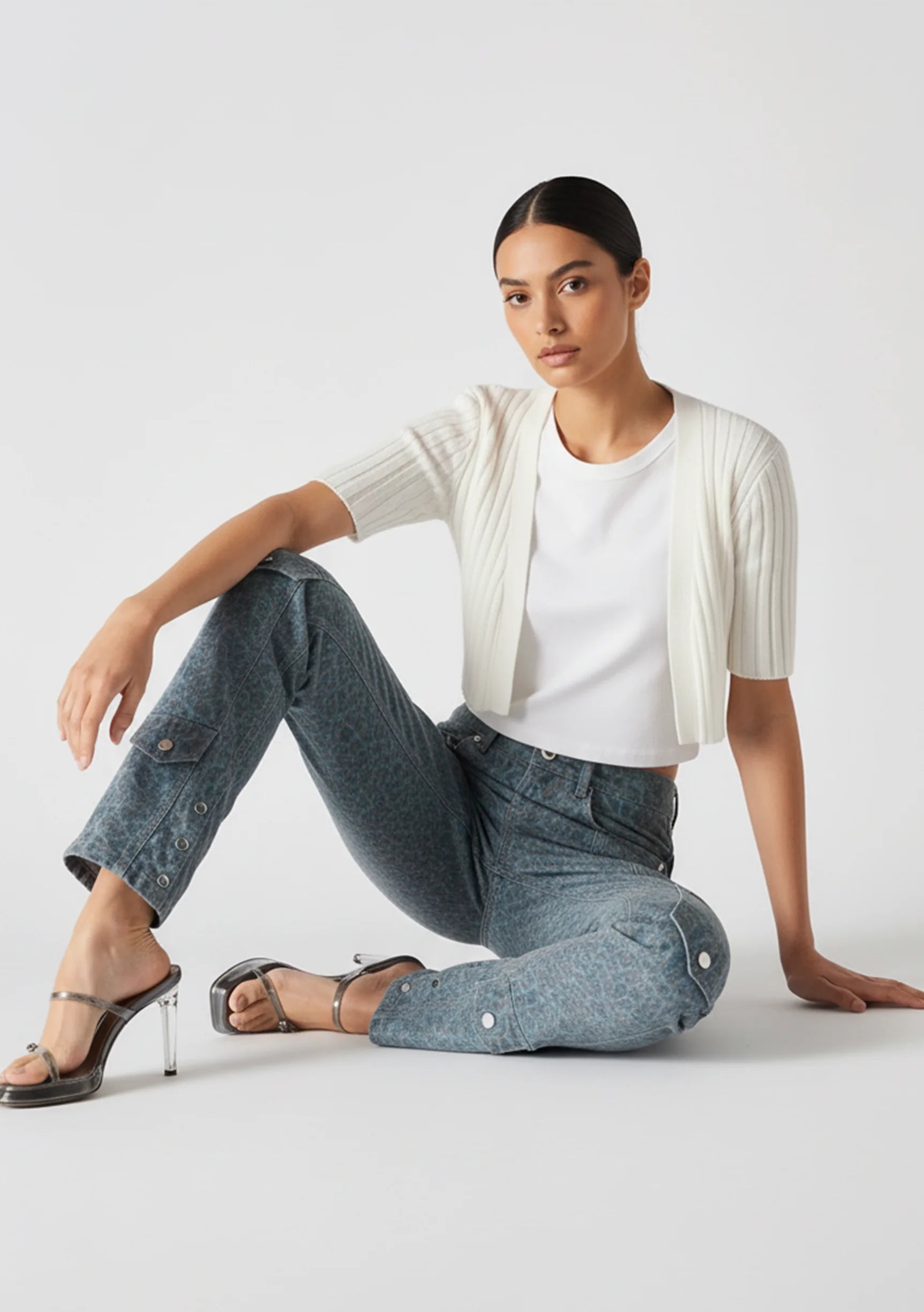 Model seated on the floor wearing Women's Speckled Blue Grey Casual Jeans
