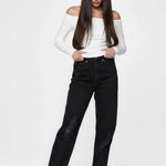Model looking down while posing in Women's Straight Leg Black Denim Pants