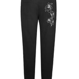 Back view of the women's tapered joggers with floral embroidery, laid flat
