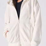 Close up showing the zip and soft fabric of the womens white zip up hoodies.