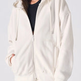 Close up showing the zip and soft fabric of the womens white zip up hoodies.