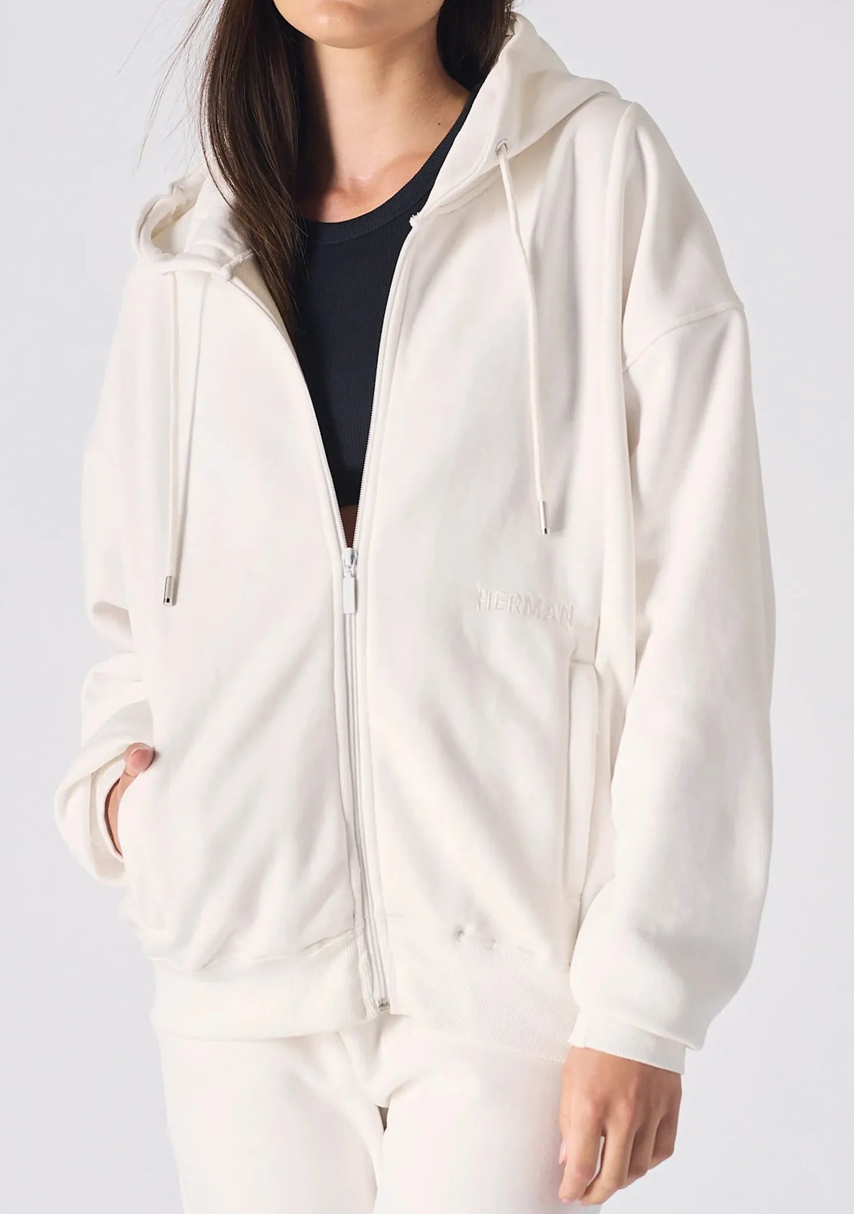 Close up showing the zip and soft fabric of the womens white zip up hoodies.