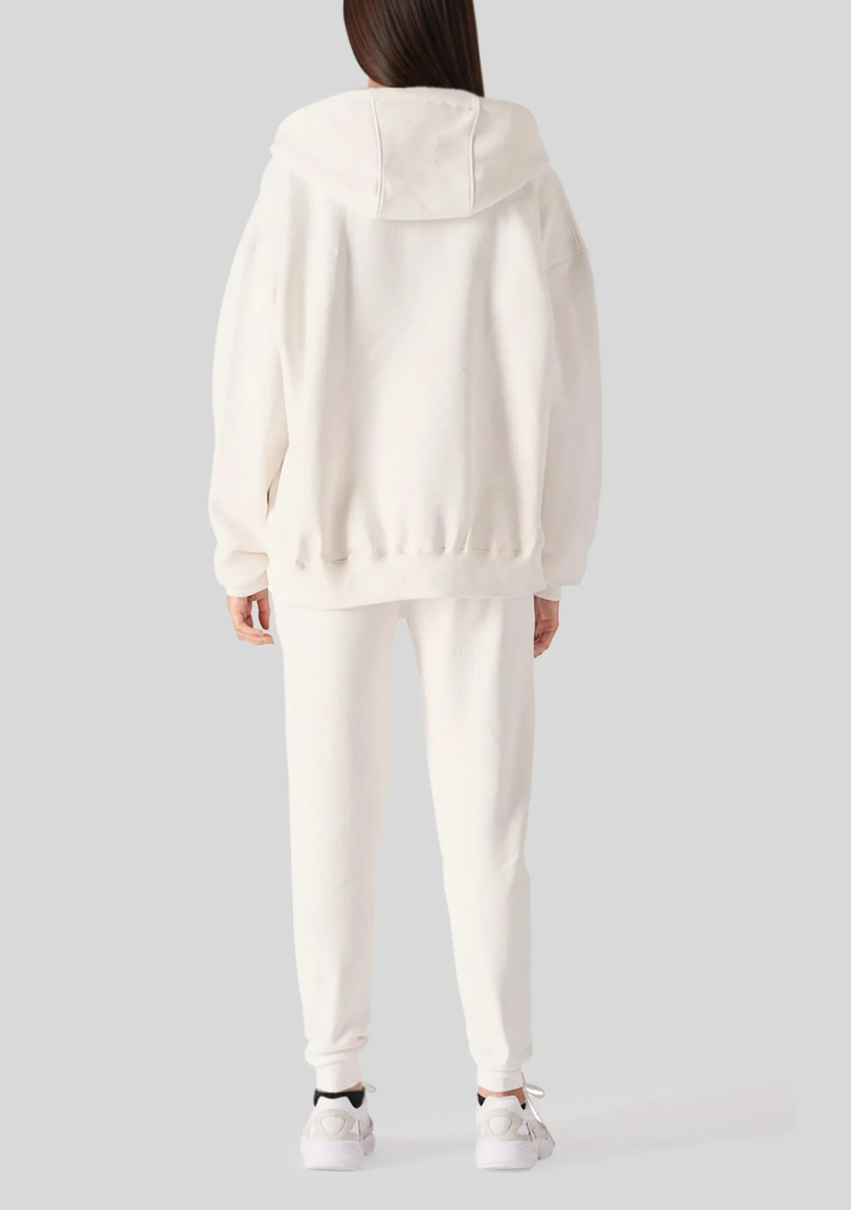 Back view showing the oversized fit of the womens white zip up hoodies.
