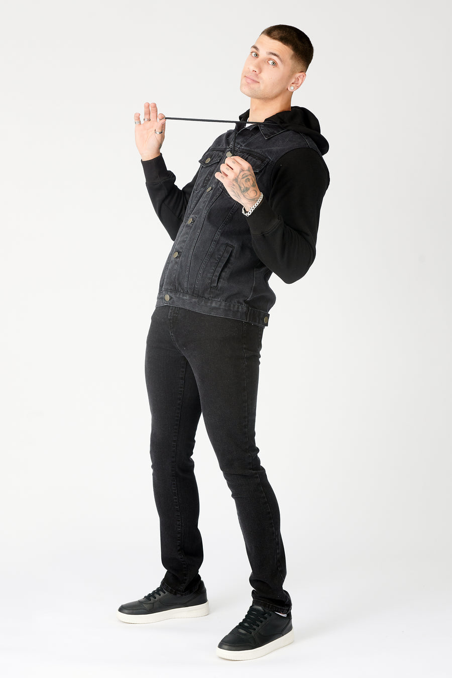 Full body shot of a standing male model wearing a JMOJO Black Wash Hooded Fleece Denim Jacket
