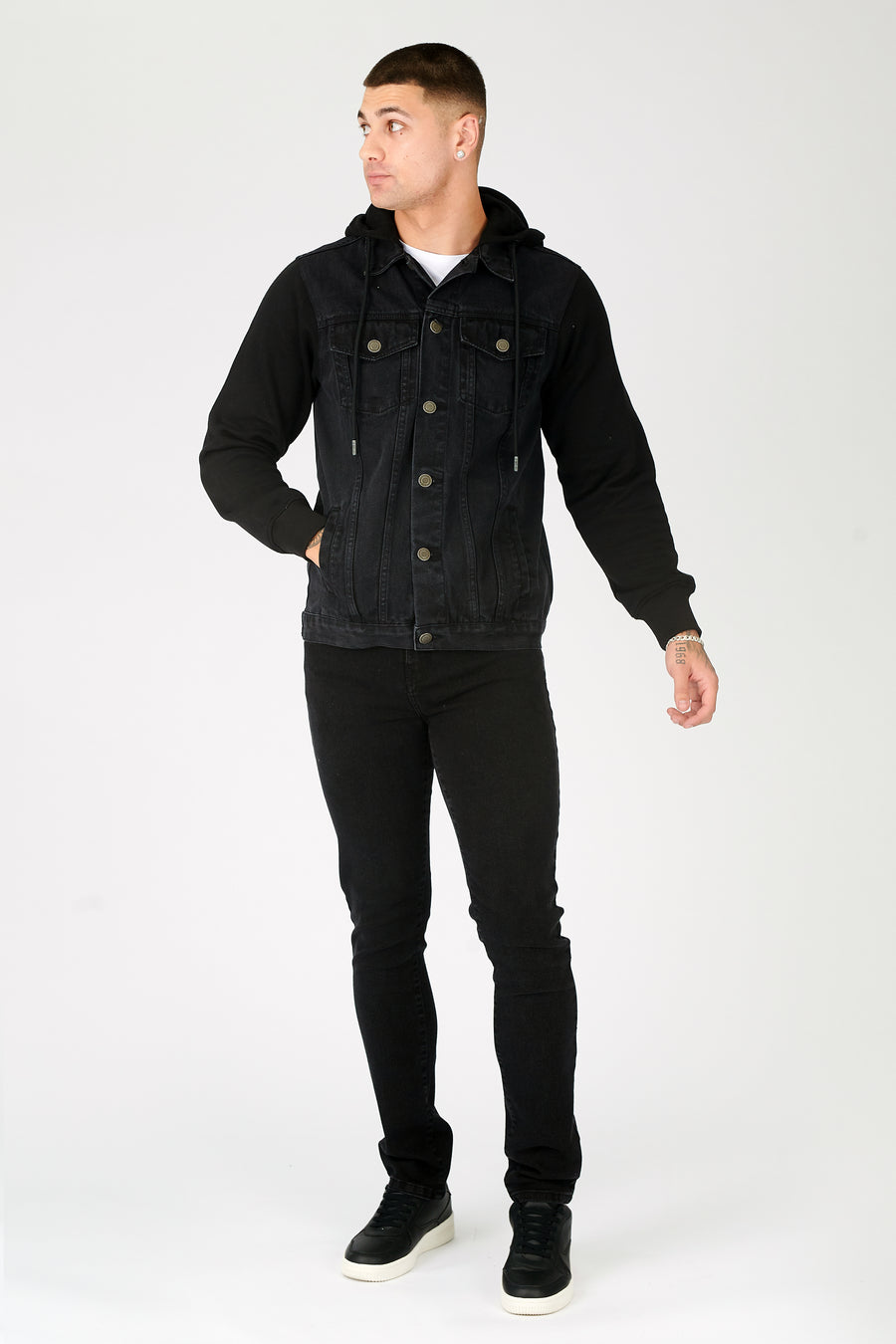 Front facing full body shot of a standing male model wearing a JMOJO Black Wash Hooded Fleece Denim Jacket