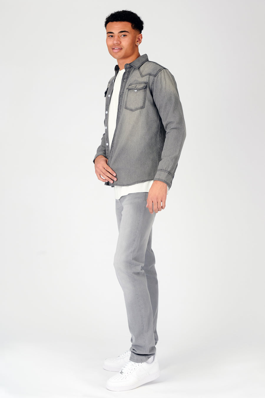 Body shot of a standing male model wearing a JMOJO Grey Wash Slim Fit Denim Shirt