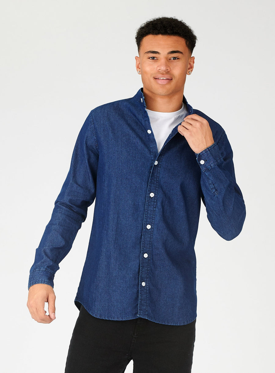 Body shot of a standing male model wearing a JMOJO Indigo Blue Slim Fit Grandad Collar Denim Shirt