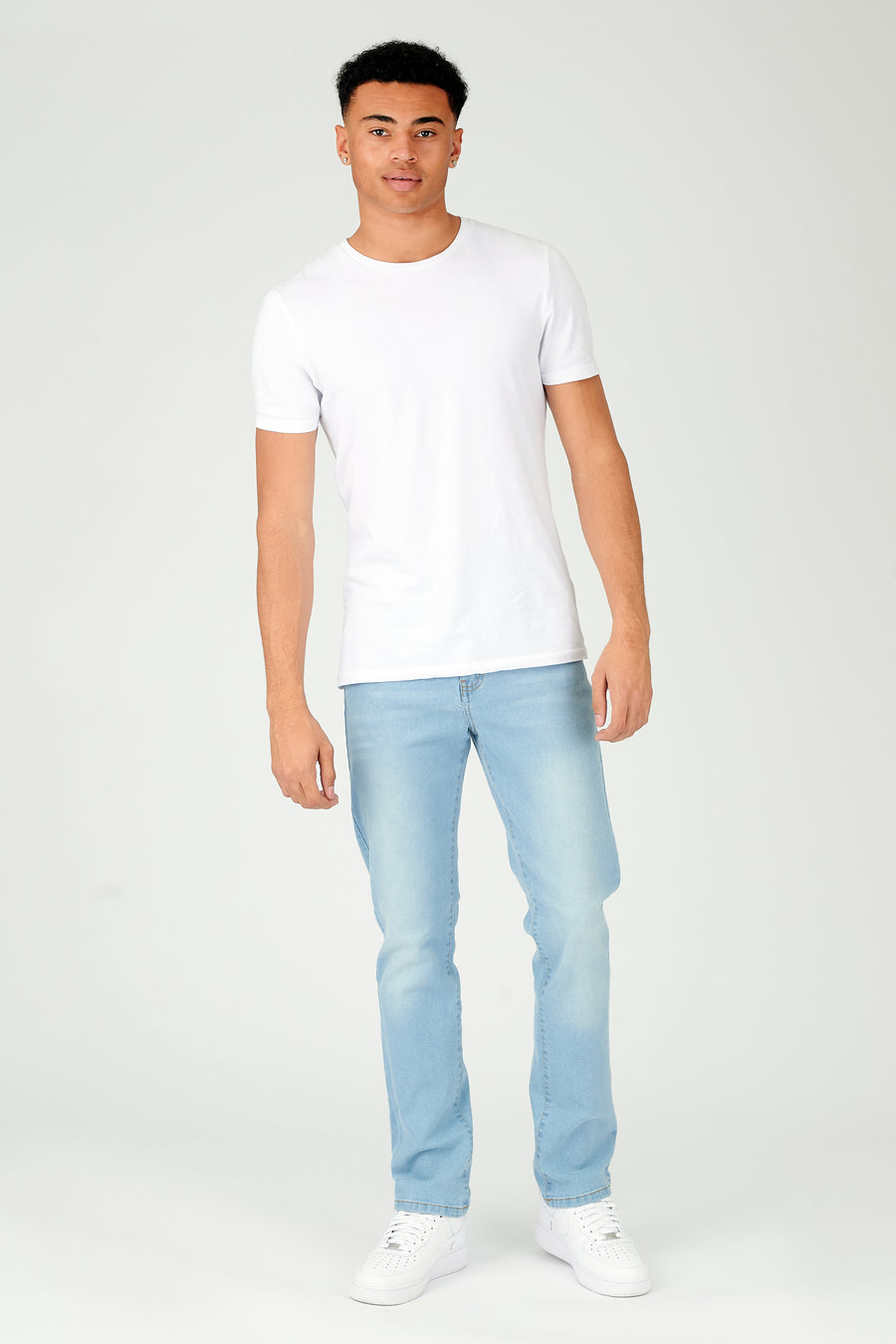 Full body shot of a standing male model wearing JMOJO Grey Wash Slim Fit Jeans