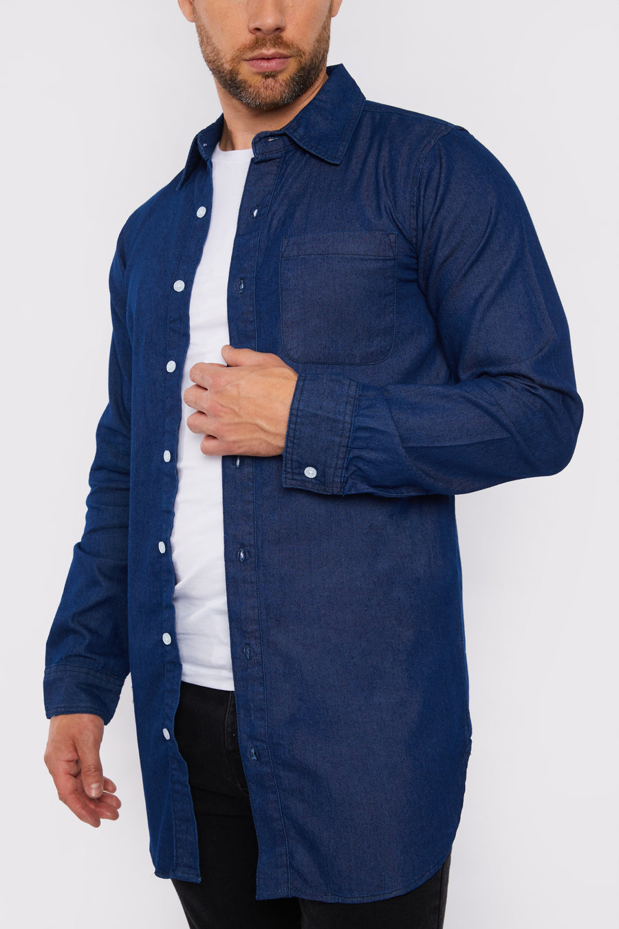 Close up product detail shot of a standing male model wearing a JMOJO Dark Blue Slim Fit Longline Denim Shirt