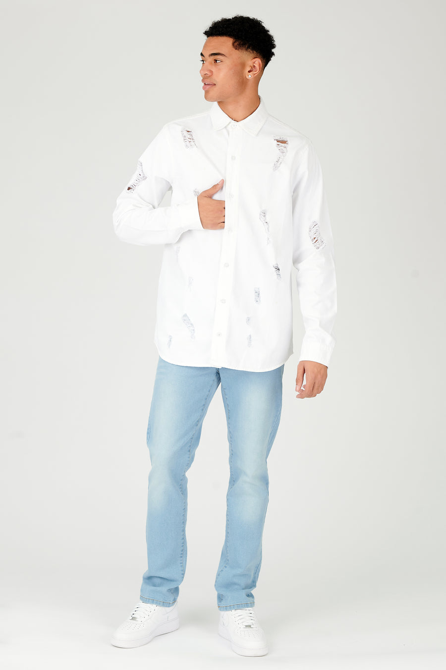 Body shot of a standing male model wearing a JMOJO White Slim Fit Ripped Denim Shirt