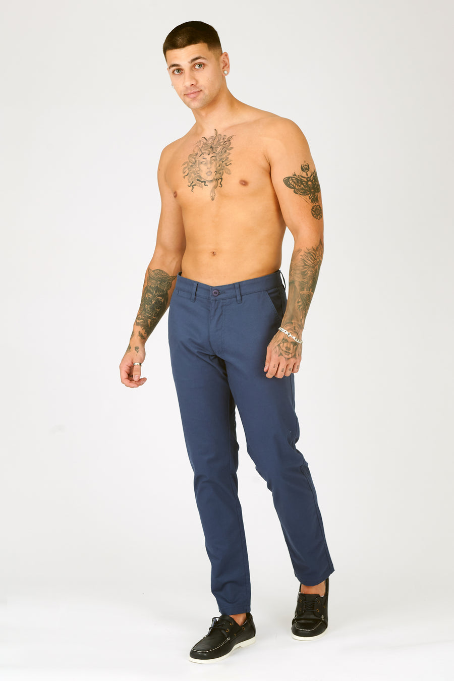 Full body shot of a standing male model wearing JMOJO Navy Slim Fit Stretch Chino Trouser