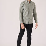 Stylish man wearing black slim fit chinos trousers.