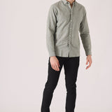 Stylish man wearing black slim fit chinos trousers.