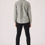 Rear view showing the clean fit of black slim fit chinos trousers.