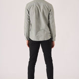 Rear view showing the clean fit of black slim fit chinos trousers.