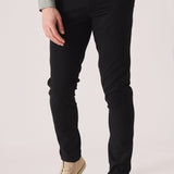 Front shot of black slim fit chinos trousers from the waist down.