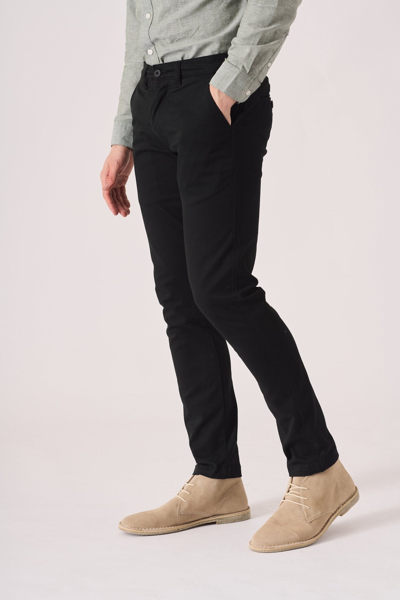 Detailed side view of the black slim fit chinos trousers.