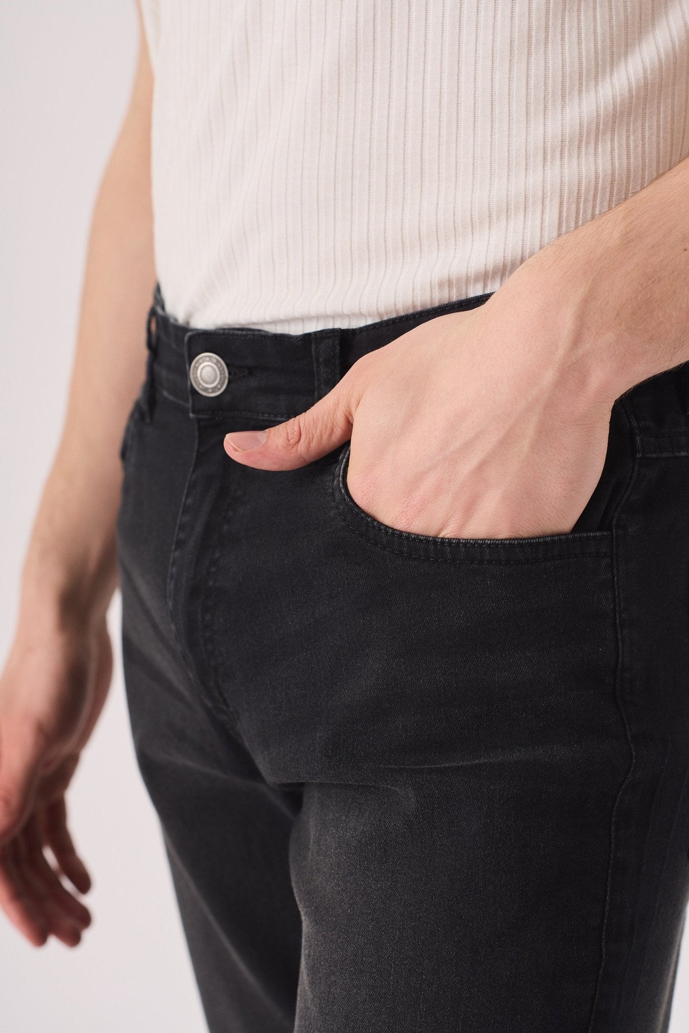 black wash slim fit jeans button fly and waistband detail