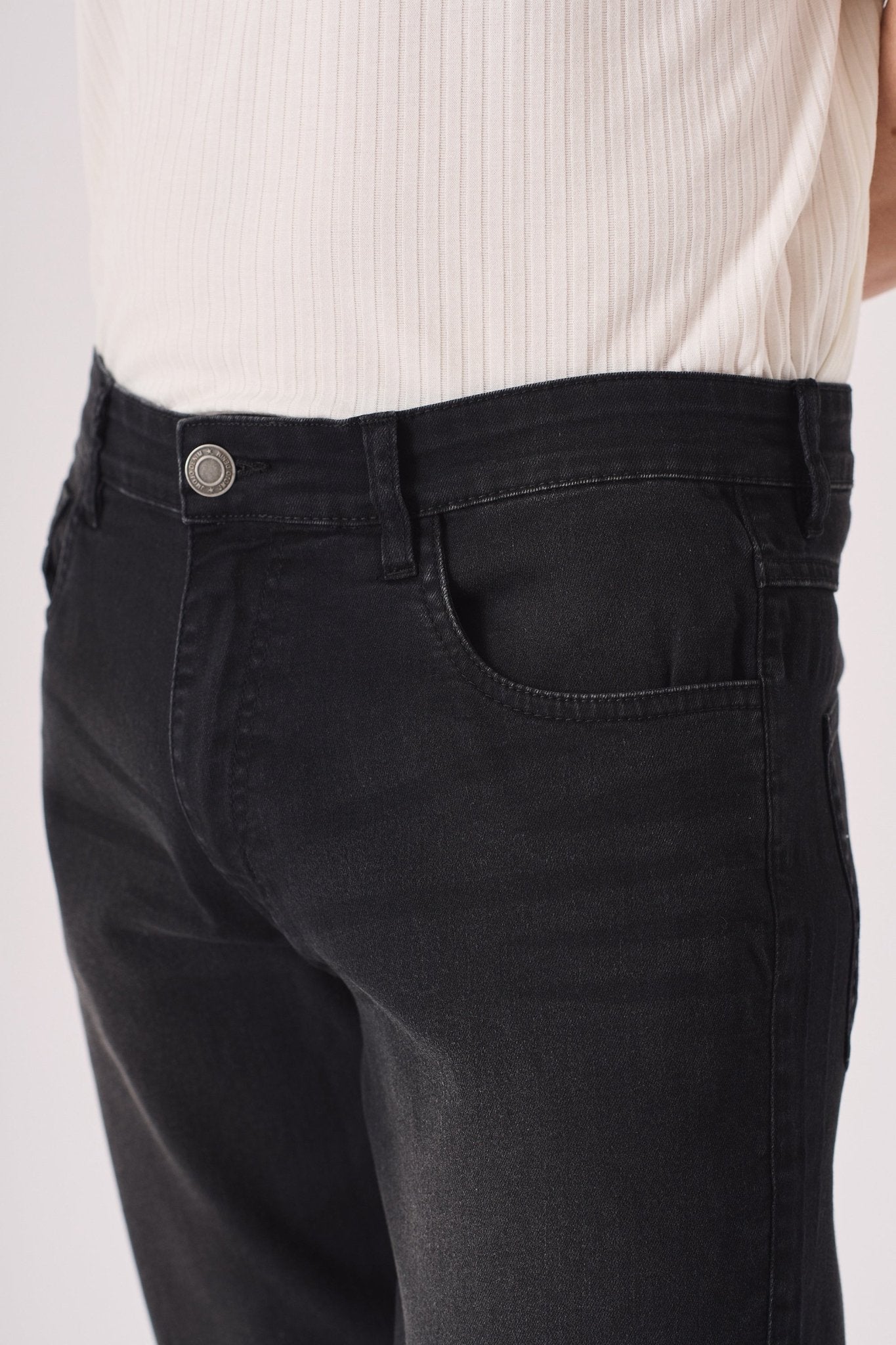 black washed slim fit denim jeans standing pose men