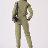 Rear view showing the fit and cut of the green tapered cargo jeans women.