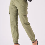 Detailed side shot showing the leg fit of the green tapered cargo jeans women.