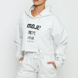 A woman wearing a stylish grey marl hoodie women's with logo detail.