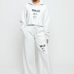 Front view of a woman posing in a comfortable grey marl hoodie women's.