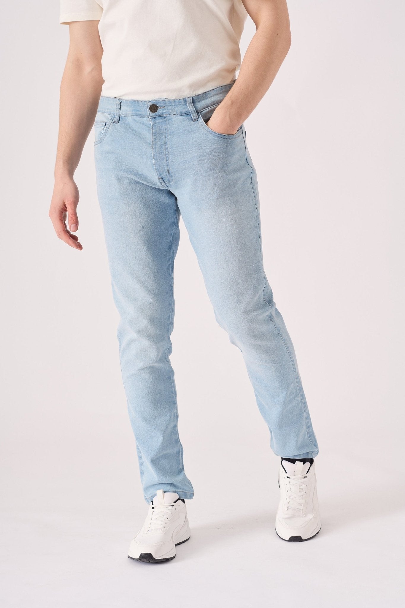 light blue slim fit stretch denim jeans hem and leg detail