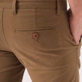 Close up shot of the rear pocket on these light brown chinos men