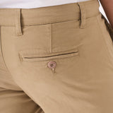 Close up shot of the buttoned rear pocket on the men's beige chinos slim fit.