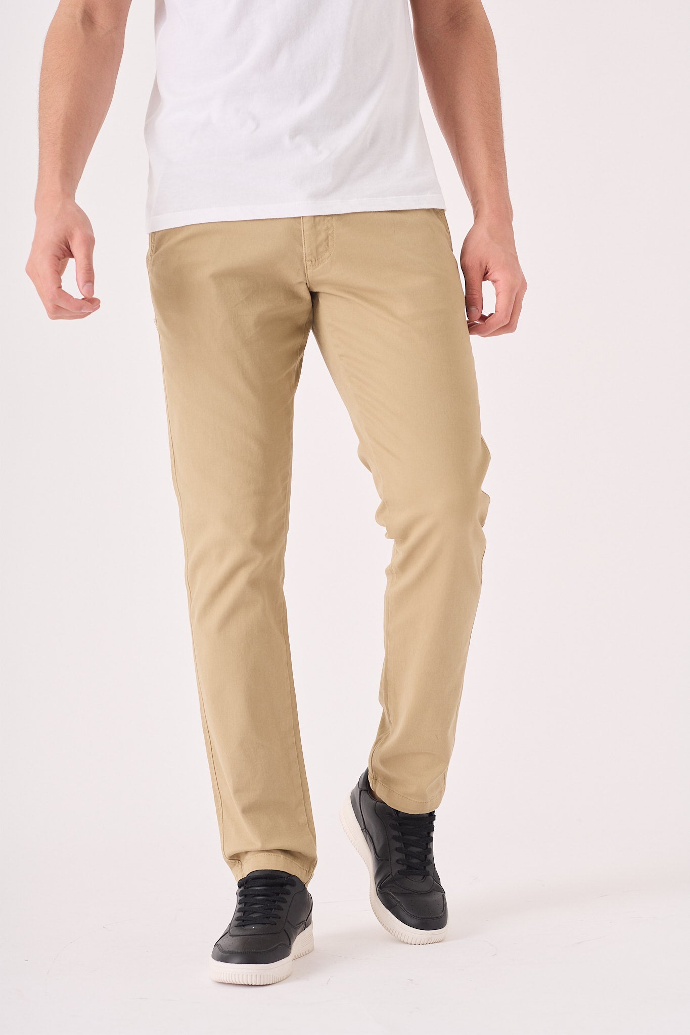 Front shot of the high quality men's beige chinos slim fit from the waist down.